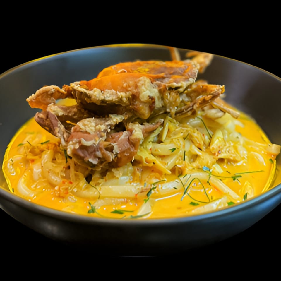 Koo Thai's soft-shell crab in a rich yellow curry sauce with bamboo shoots and herbs.